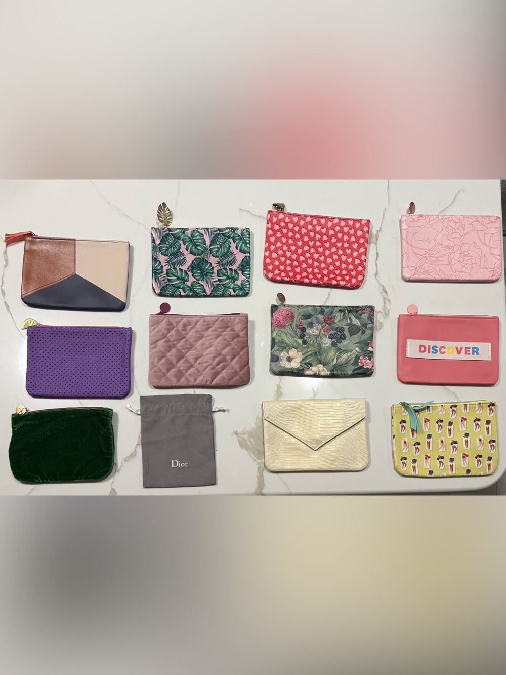 Assorted colorful cosmetic bags and pouches maily from Ipsy